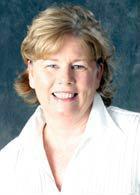 A person smiling in a white shirt, titled Furlong.