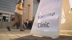 Outdoor scene with a sign titled MENINGITIS CLINIC.