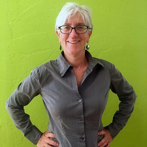 Michelle Burnham with a green background