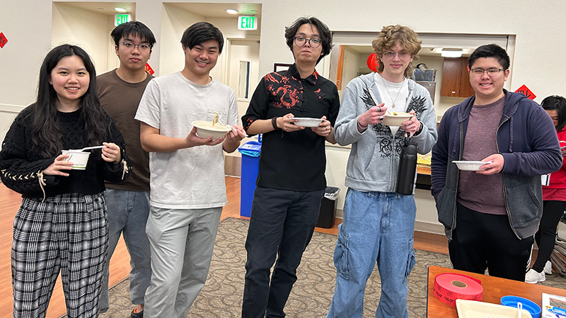 Students enjoy good food for Chinese New Year.