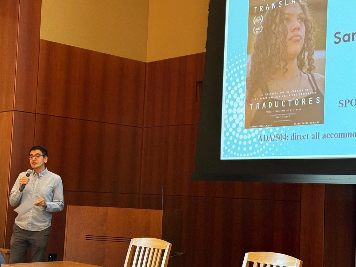 Abel Cruz speaking at the Bilingualism and Social Justice event