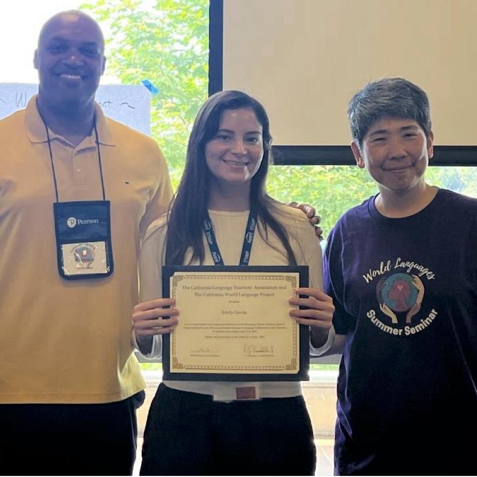 Emily Garcia receiving her award.