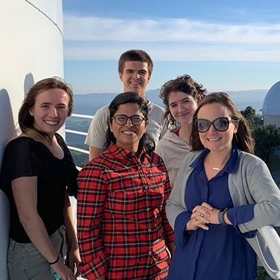 SCU astrophysicist Kristin Kulas far right with current SCU students and NASA colleagues on the catwalk of the Shane Telescope at nearby Lick Observatory