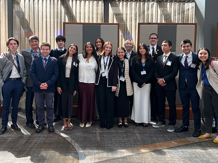 Group photo of Kenneth Faulve-Montojo and Model United Nations students.