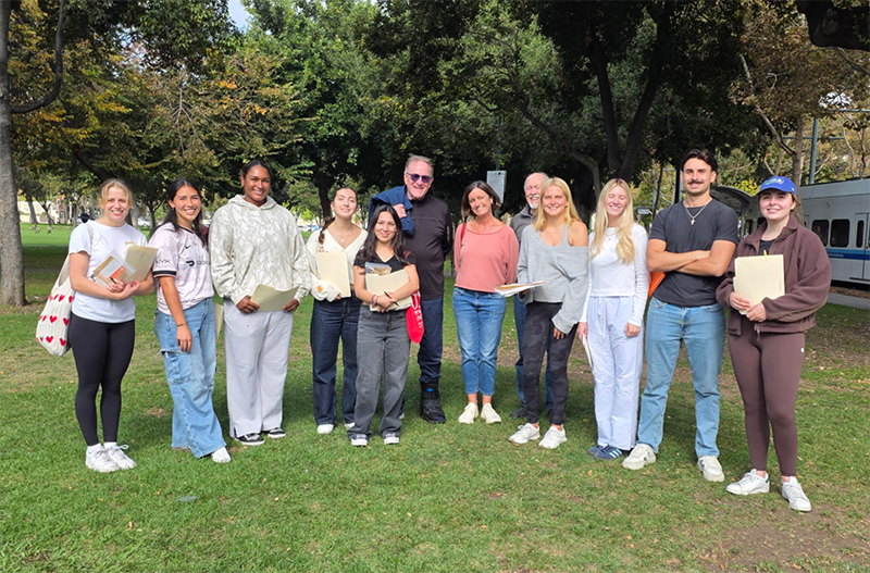 PHSC 190 Senior Capstone students during Wellness survey data collection at St James Park, with community collaborator Todd Langton of Agape Silicon Valley, Unhoused Initiative faculty member Philip Riley and Professor Mackenzie.