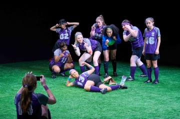 College womens soccer team posing for group photo