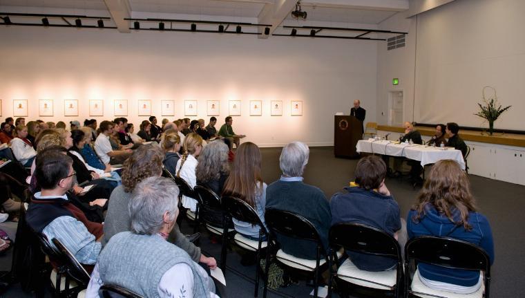 Visitors listening to a panel discussion at the de Saisset Museum.