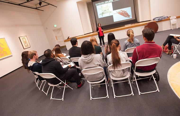 Students listening to presentation by de Saisset Museum curator.