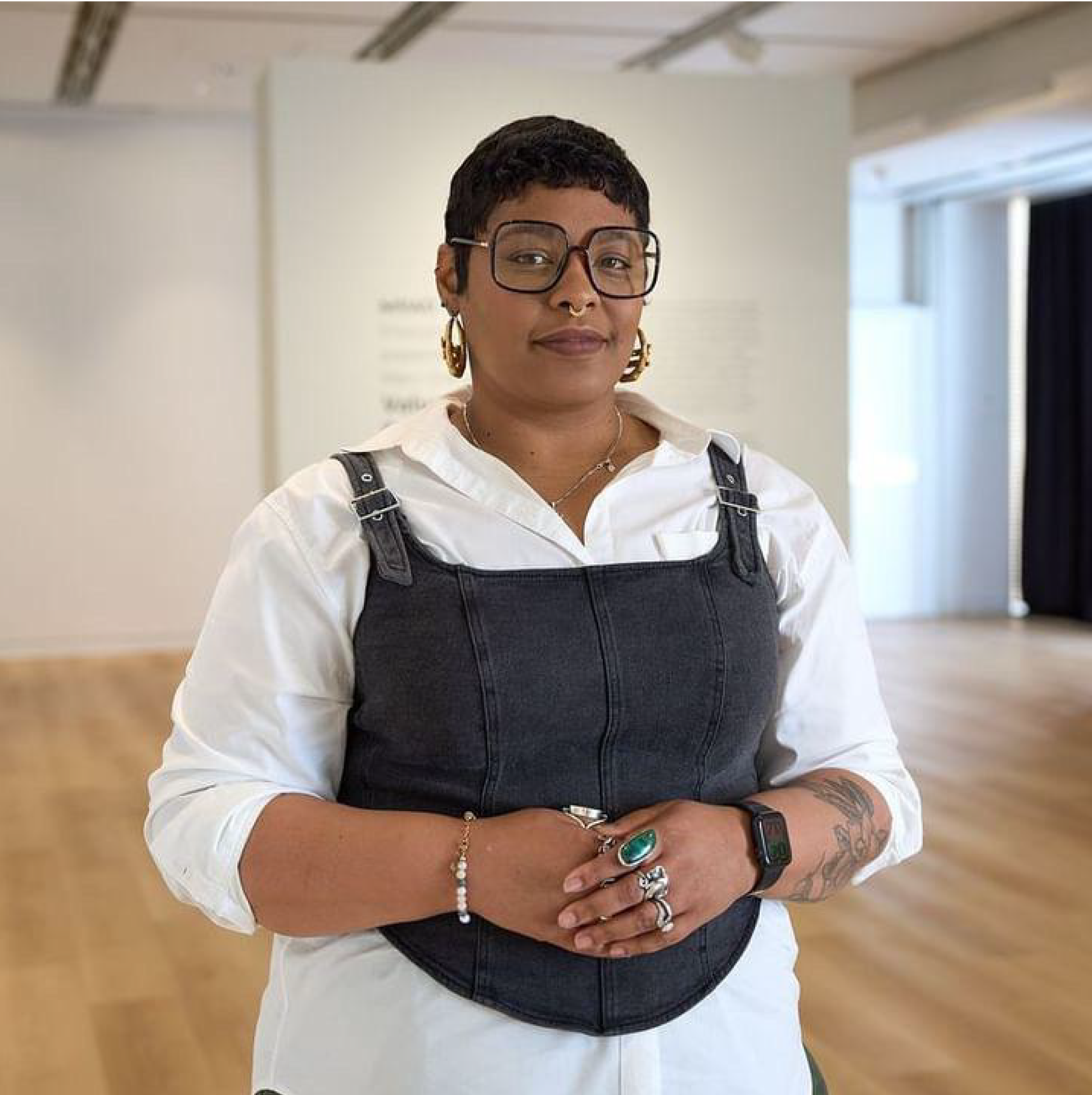 Photograph of woman standing in a gallery