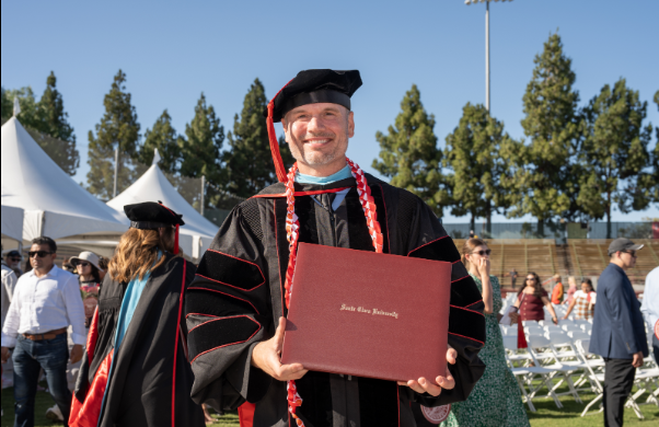 A student holding degree