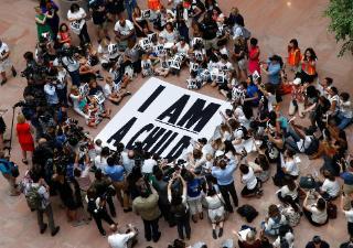 Families with young children protest the separation of immigrant families with a sit-in at the Hart Senate Office Building, Thursday, July 26, 2018, on Capitol Hill in Washington. (AP Photo/Jacquelyn Martin)