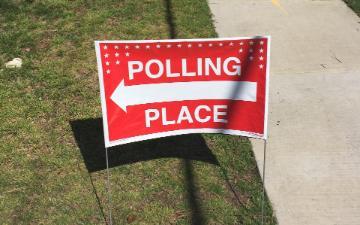 polling place sign with arrow