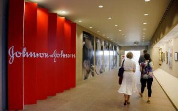 People walking in hallway at Johnson Johnson corporate office