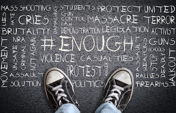 Person standing on chalkboard with words 'Ethical storytelling' and other phrases.