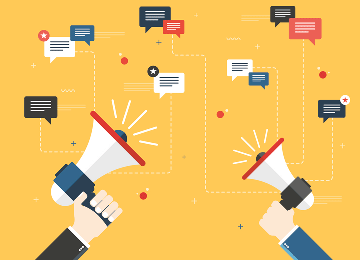 hands holding megaphones