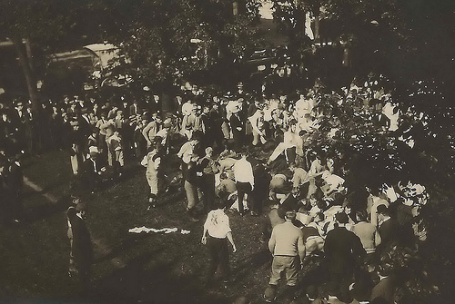 Black and white photo of people standing outside