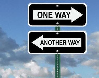 Two arrow road signs. One points right and has text reading, one way and the other points left and has text reading,another way, indicating confusion about which way to go.