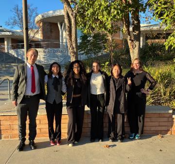 2025-26 SCU Ethics Bowl Team: Shelly Cormier, Darcy Muller, Tiffany Nguyen, Joshua Nesdahl, and Jenna Roseto and Ethics Bowl Coach/SCU PhilosophyTeaching Professor Erin Bradfield. The team competed at the CA Regional Ethics Bowl on Dec. 6, 2025 at Grossmont College in El Cajon, CA. Photo courtesy of Erin Bradfield.