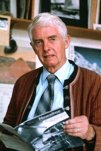 An elderly man holding a book. image link to story