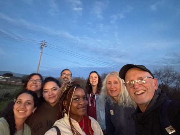 Mahi Shah ('24-'25 Environmental Ethics Fellow), Giselle Aviles SCU '25, Sophia Toribio SCU '28, Professor Allan Baez Morales, Victory Chika-Okafor SCU '27, Professor Rocio Lilen Segura, Professor Iris Stewart-Frey, and David DeCosse of the Ethics Center at the levee in Pajaro, CA.
