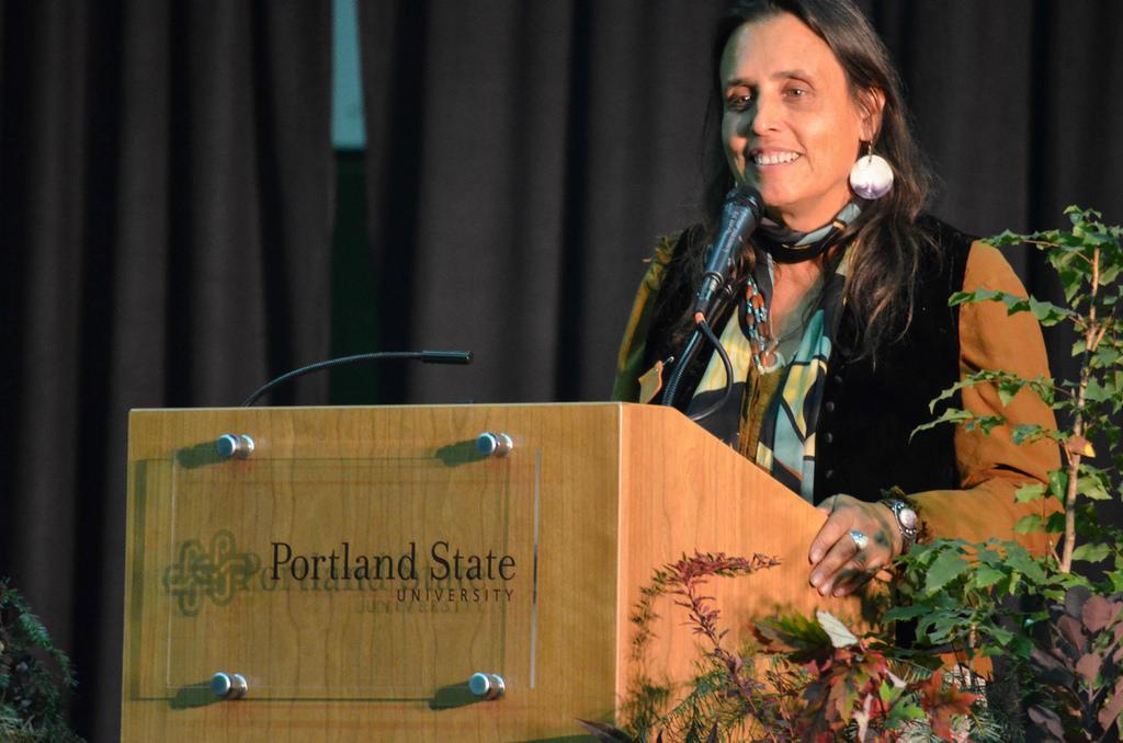 Person speaking at a podium with LaDuke text. image link to story
