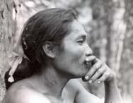 A person in profile, resting their chin on their hand.