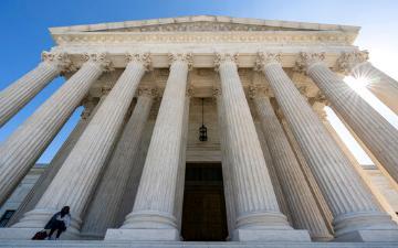 The front view of the Supreme Court building with large columns.