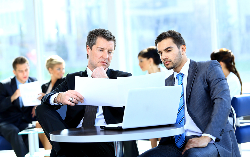 Two businessmen at a computer