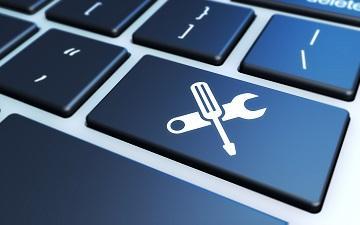 Keyboard keys with tool icons symbolizing an ethical toolkit for technologists.