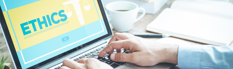 Man typing on laptop Screen displays a website with the word ethics