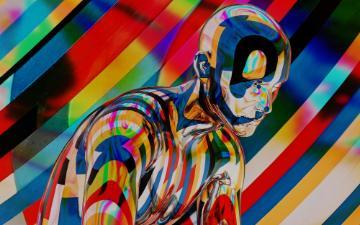 Robot against a multicolored background Photo by Shaan Pagadala on Unsplash