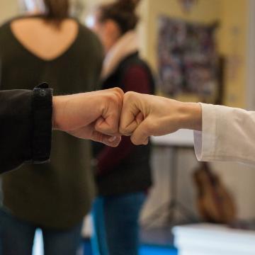 Arrupe Engagement Fist Bump