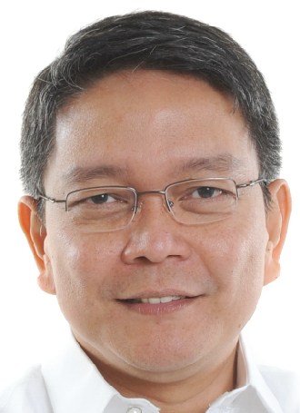 Man wearing glasses smiling at the camera. image link to story