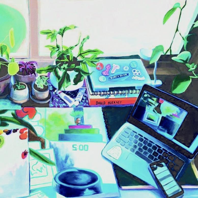 Workspace with laptop, plants, coffee cup, documents, and various items.