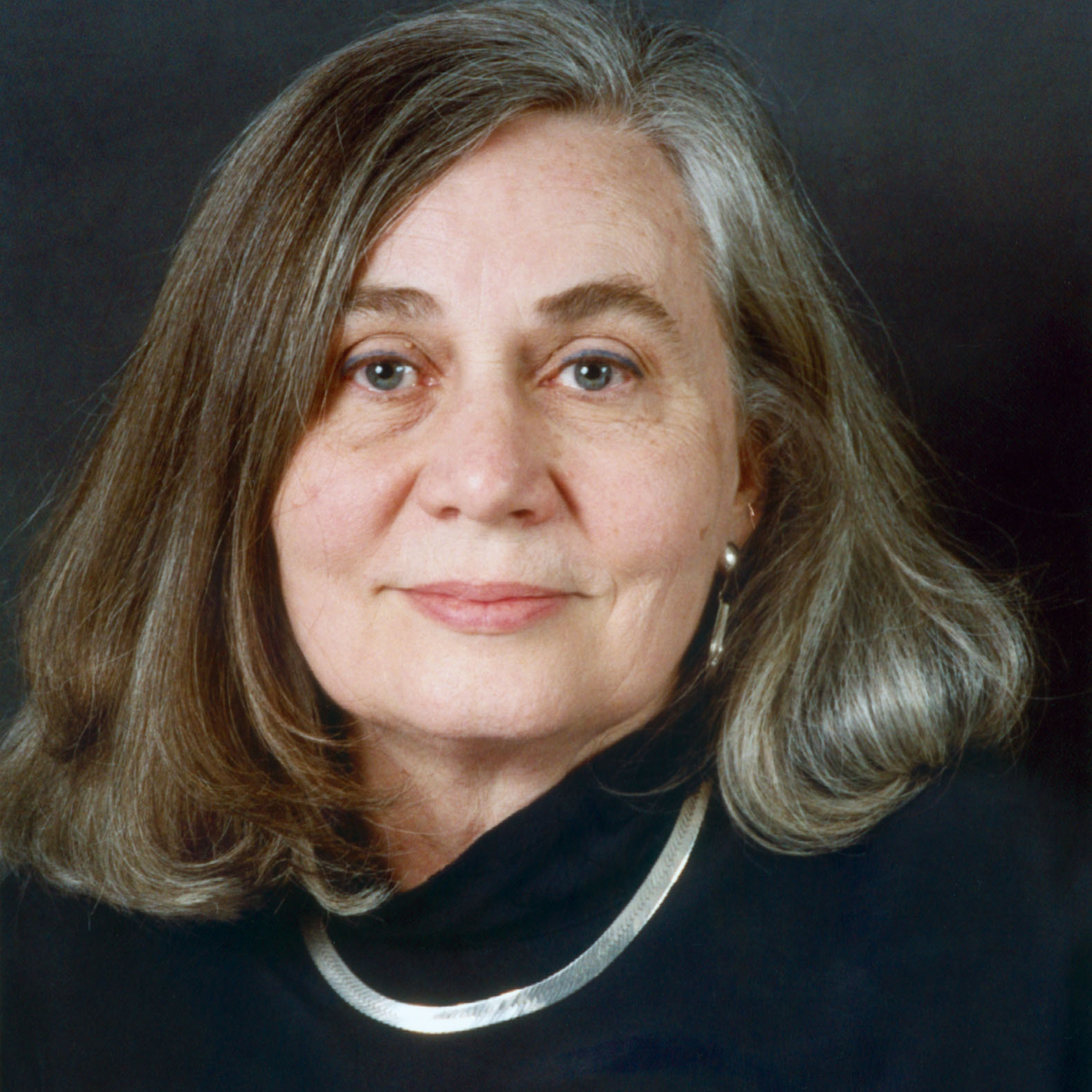 Marilynne Robinson facing forward, wearing a dark top with a white collar. image link to story
