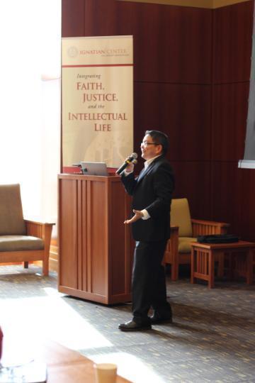 Person standing and speaking at 2016 Santa Clara Lecture next to a podium.