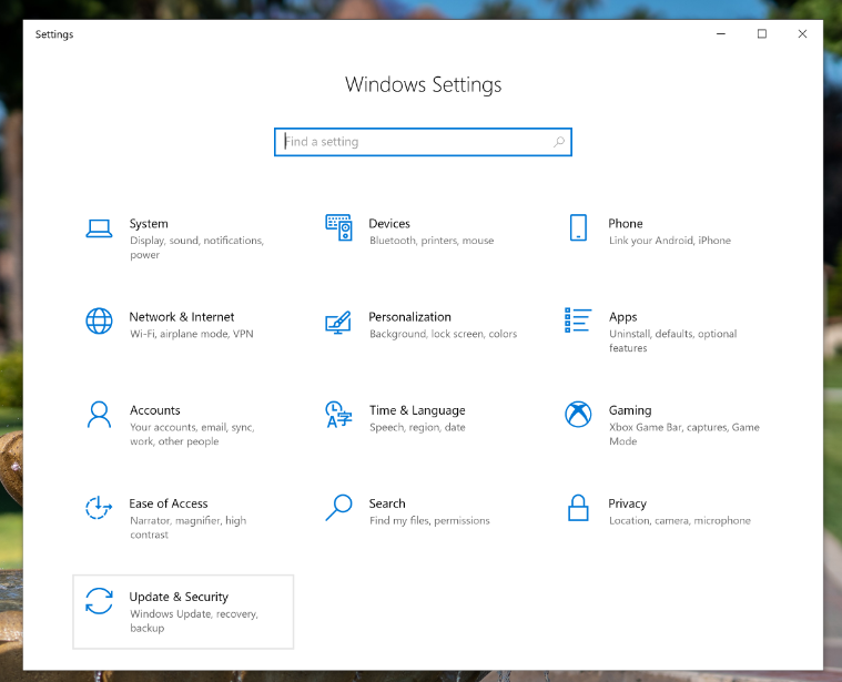 An image of the Windows 10 Windows Settings page with a red arrow pointing to the Update & Security option.