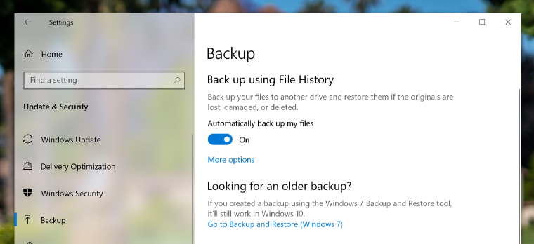 An image of the Windows 10 Backup page showing a red arrow pointing to the Automatically back up my files toggle set to On.