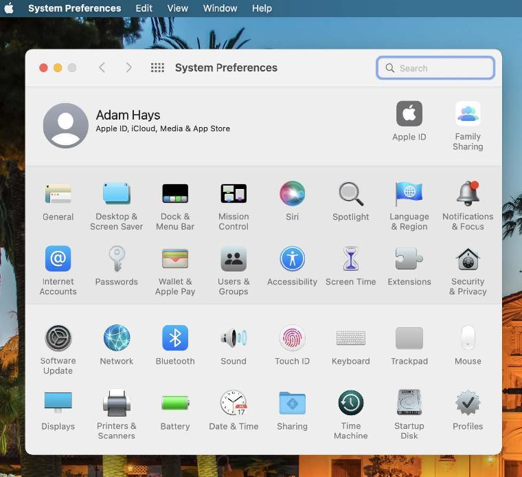 An image of the Apple System Preferences panel with a red arrow pointing to Time Machine.