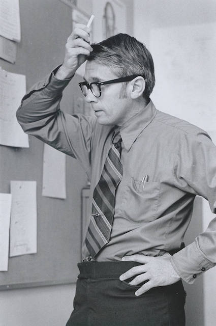 Examining a classroom equation, back in the day. Photo courtesy SCU Archives.