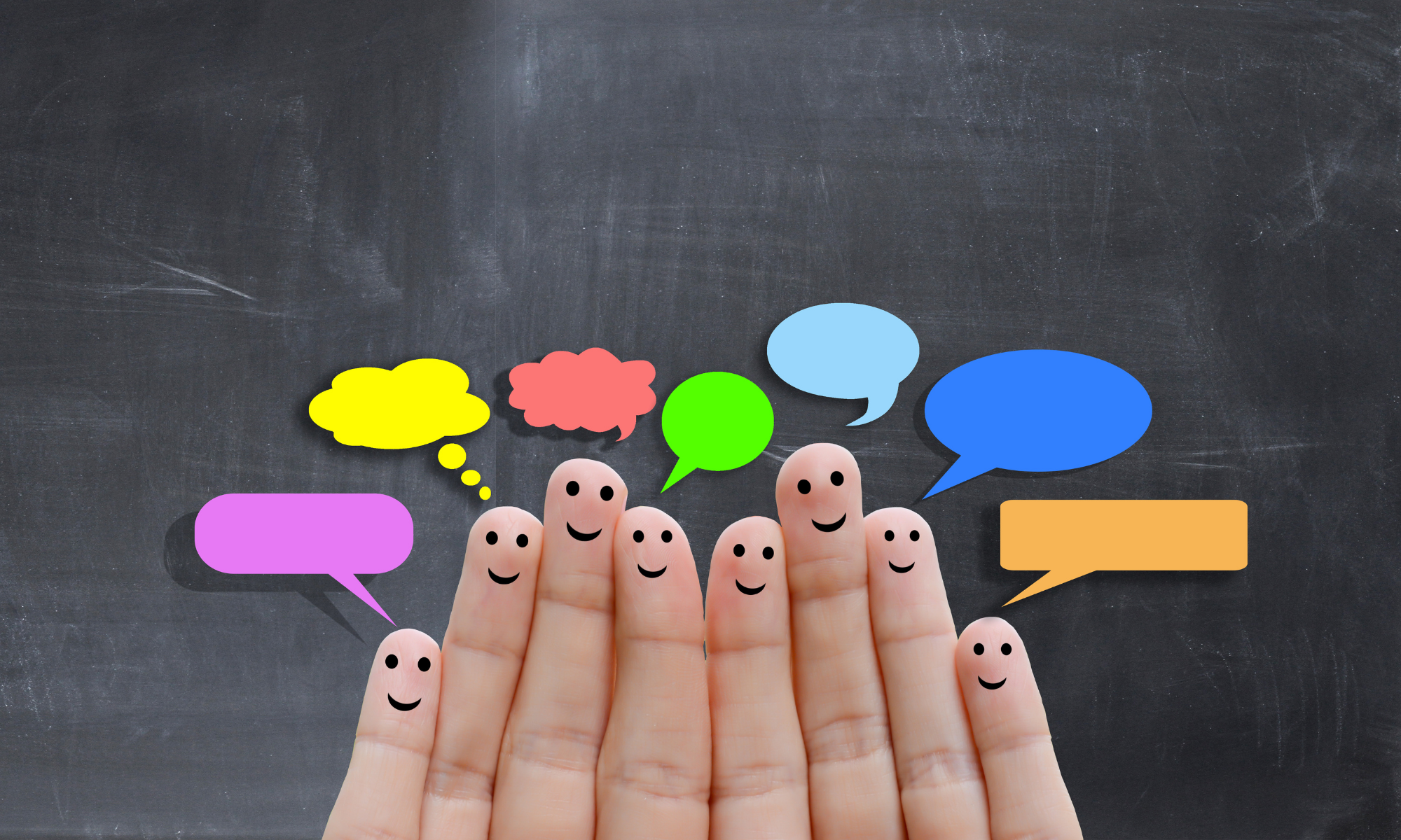 Fingers with faces and colorful chat bubbles above them on a dark background.