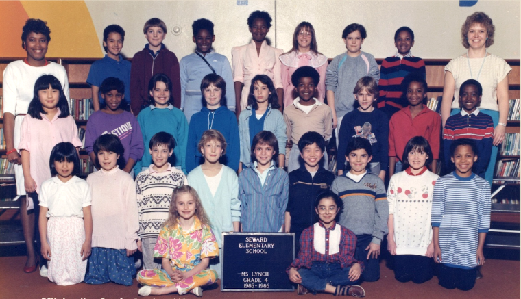 A class photo of 4th grade students standing in rows