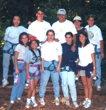 A group of students circa 1997 pose for a photo while wearing climbing gear