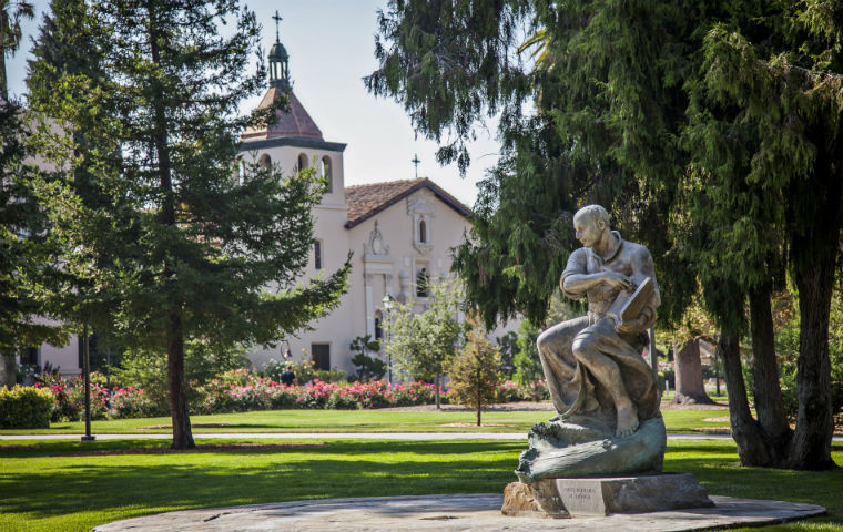 Photo of St. Ignatius statue w/ Mission Church in background