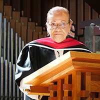 Photo of JST Commencement Speaker Maria Pilar Aquino at podium