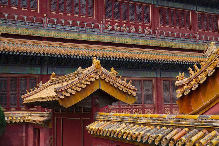 Ornate rooftop details of traditional Chinese architecture in Beijing.