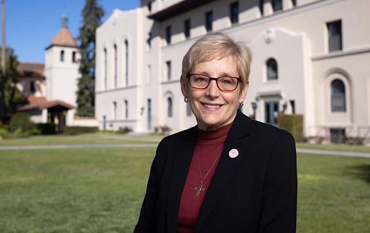 Incoming President Julie Sullivan stands in front of St. Joseph's hall