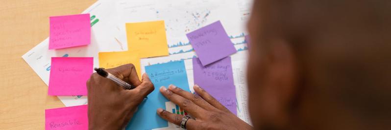 Student studying with bright colored note cards