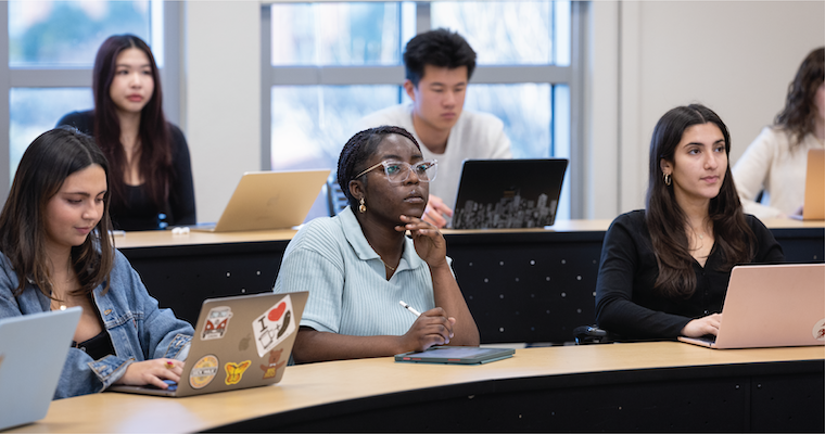 Leavey students listening attentively in a classroom