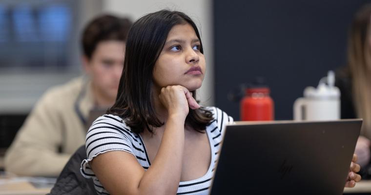 Leavey student with laptop in class
